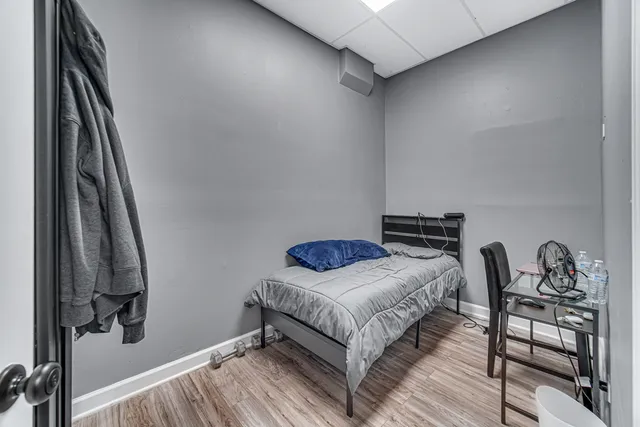 a bedroom with a bed and a table