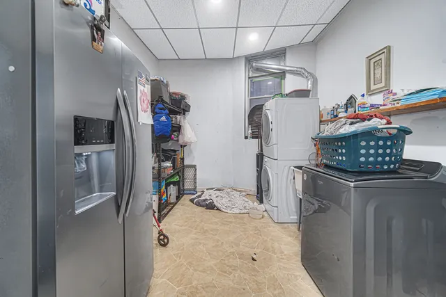 a kitchen with stainless steel appliances granite countertop a refrigerator and stove