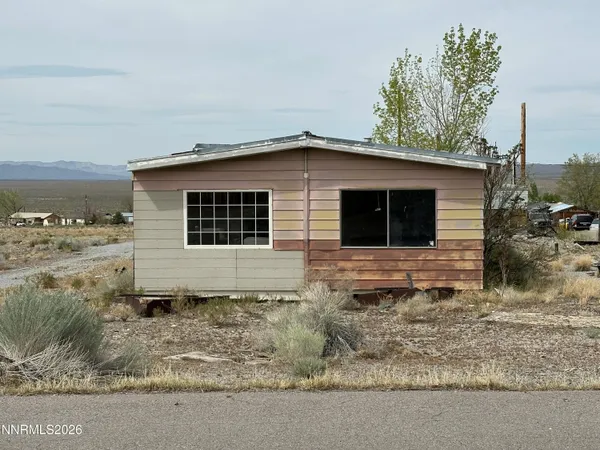 a house view with a backyard space