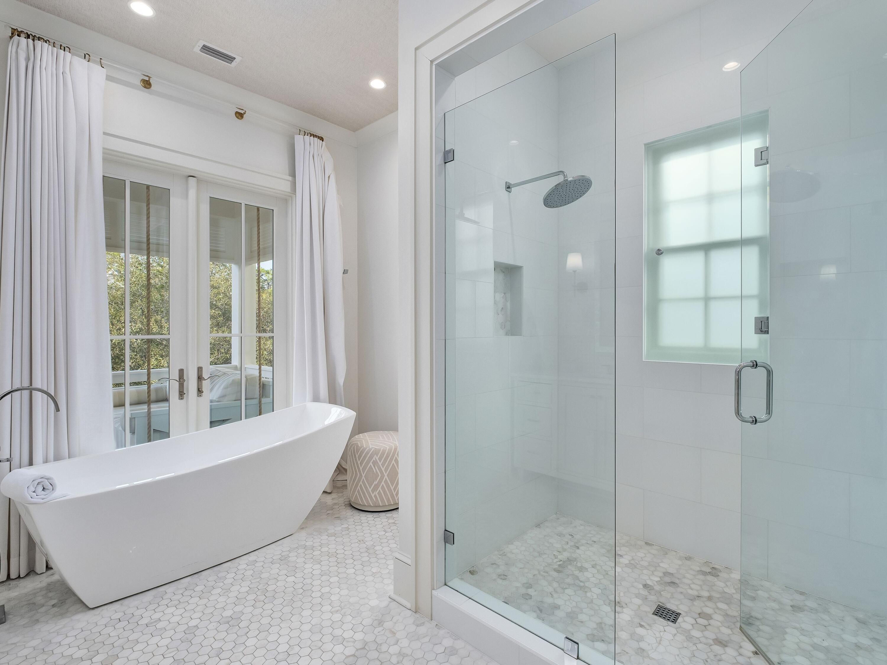 26 Rain Lily Lane Santa Rosa Beach, FL 32459 - Photo 18 of 45 a bathroom with a tub shower and mirror