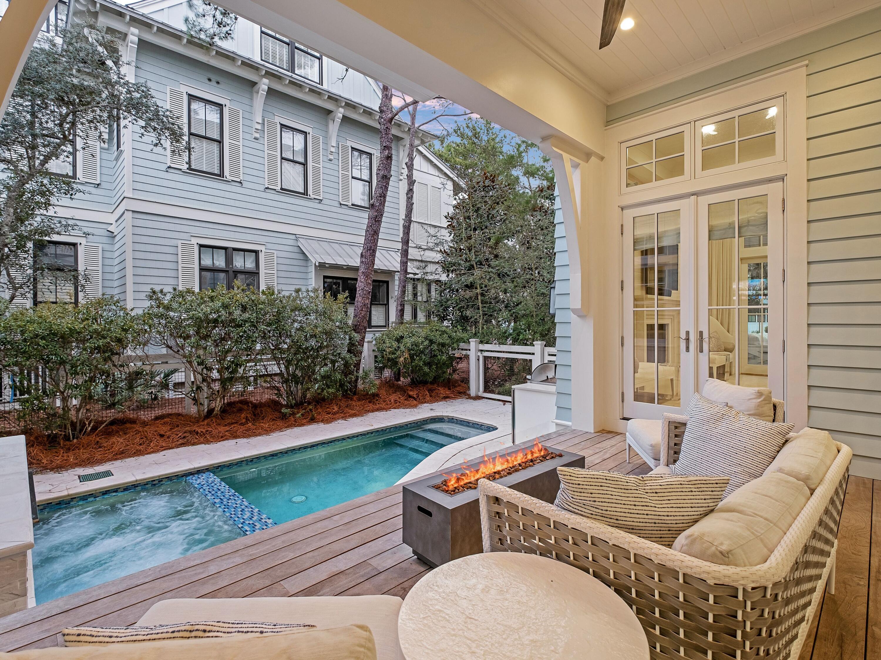 26 Rain Lily Lane Santa Rosa Beach, FL 32459 - Photo 37 of 45 a balcony with furniture and a garden