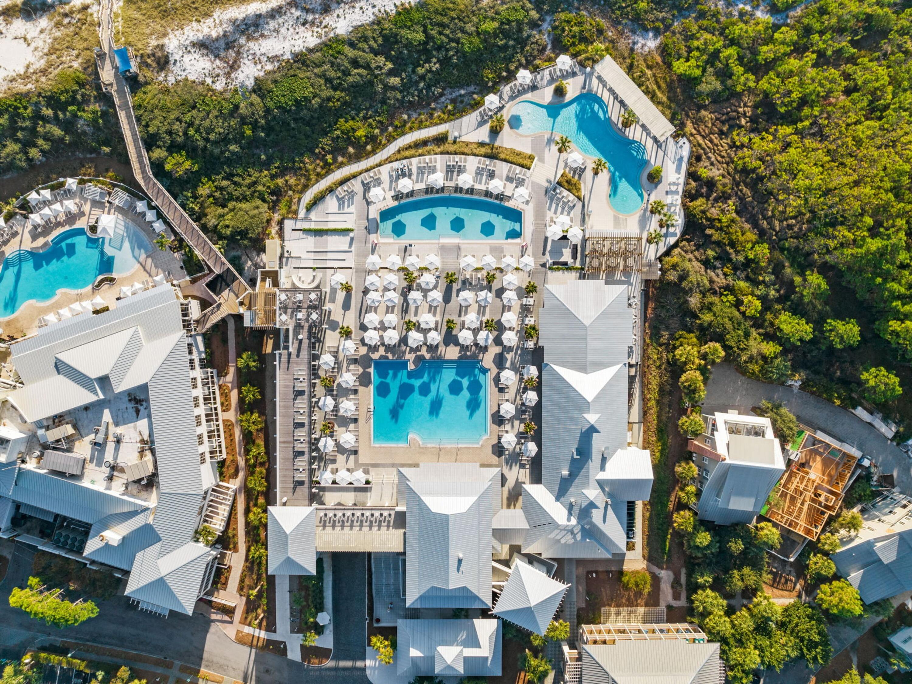 26 Rain Lily Lane Santa Rosa Beach, FL 32459 - Photo 40 of 45 an aerial view of multi story residential apartment building with yard and parking