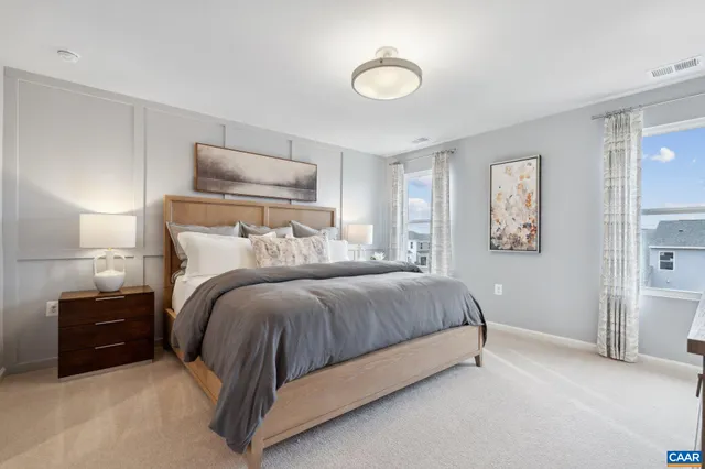 a bedroom with a bed and lamp