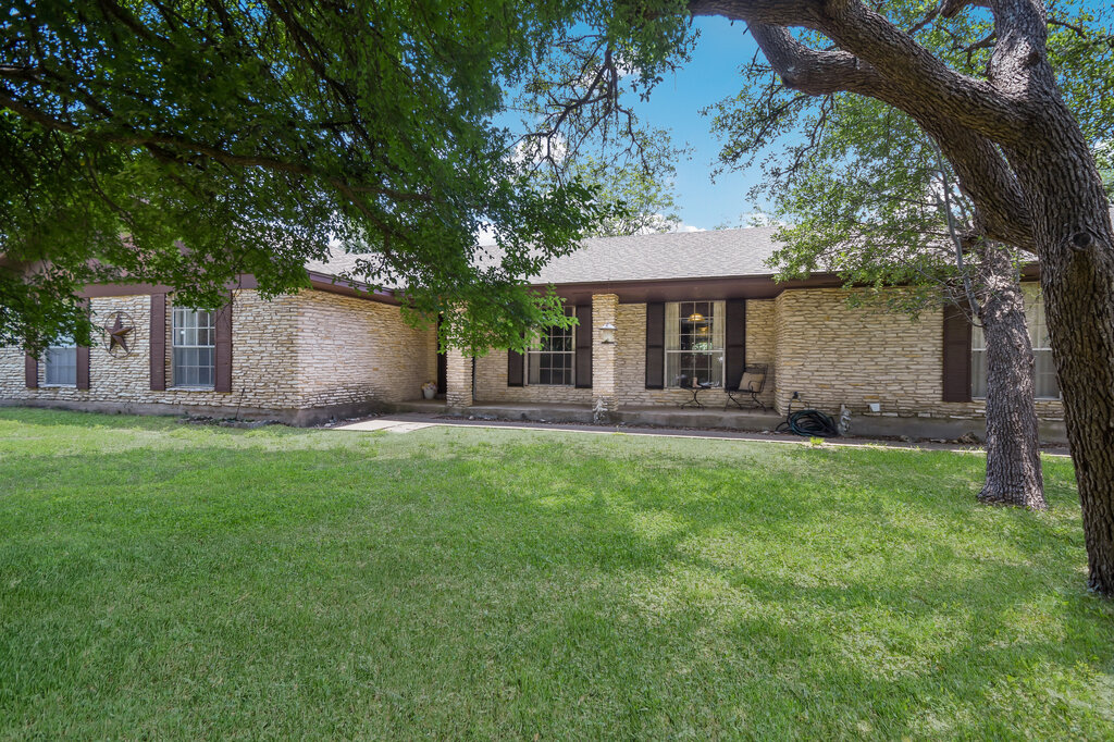 301 Navajo Trail Georgetown, TX 78633 - Photo 18 of 35 Ranch-style home featuring a front lawn and stone siding