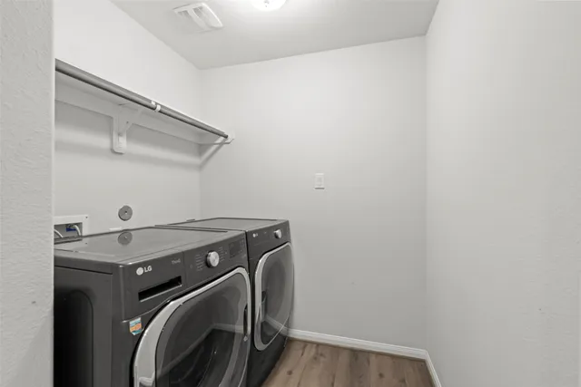 a utility room with dryer and washer