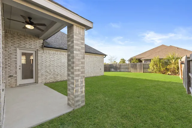 a view of a backyard of the house