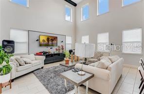 7211 Still Pond Lane Windermere, FL 34786 - Photo 5 of 17 a living room with furniture and a flat screen tv