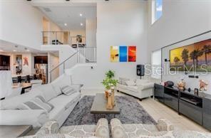 7211 Still Pond Lane Windermere, FL 34786 - Photo 6 of 17 a living room with furniture and a flat screen tv