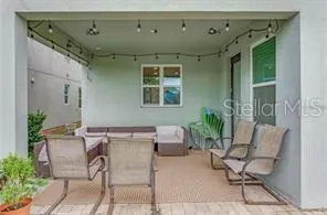 a balcony with furniture and potted plants