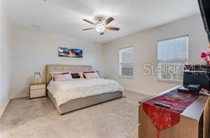 7211 Still Pond Lane Windermere, FL 34786 - Photo 10 of 17 a bedroom with a bed and a desk