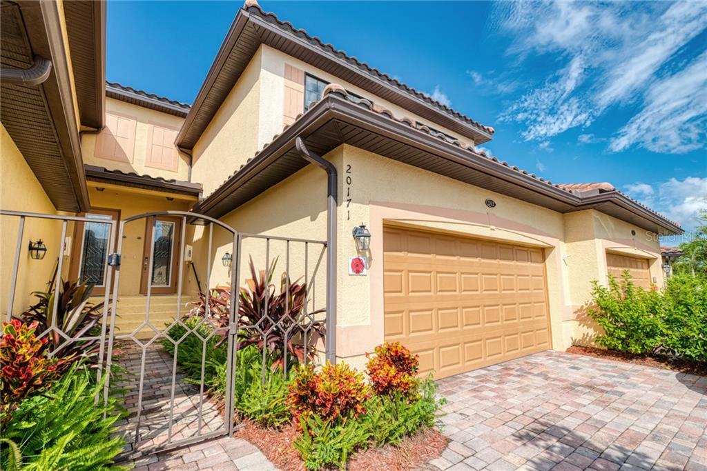 20171 Ragazza Circle, Unit 202 Venice, FL 34293 - Photo 1 of 1 Front entry and 2.5 garage