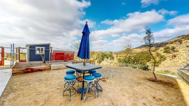 a view of a terrace with furniture