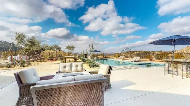 a view of a swimming pool with a lounge chairs