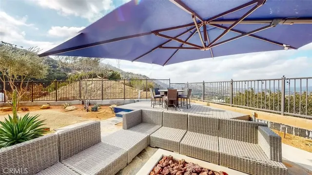 a view of a swimming pool with a couches in a patio