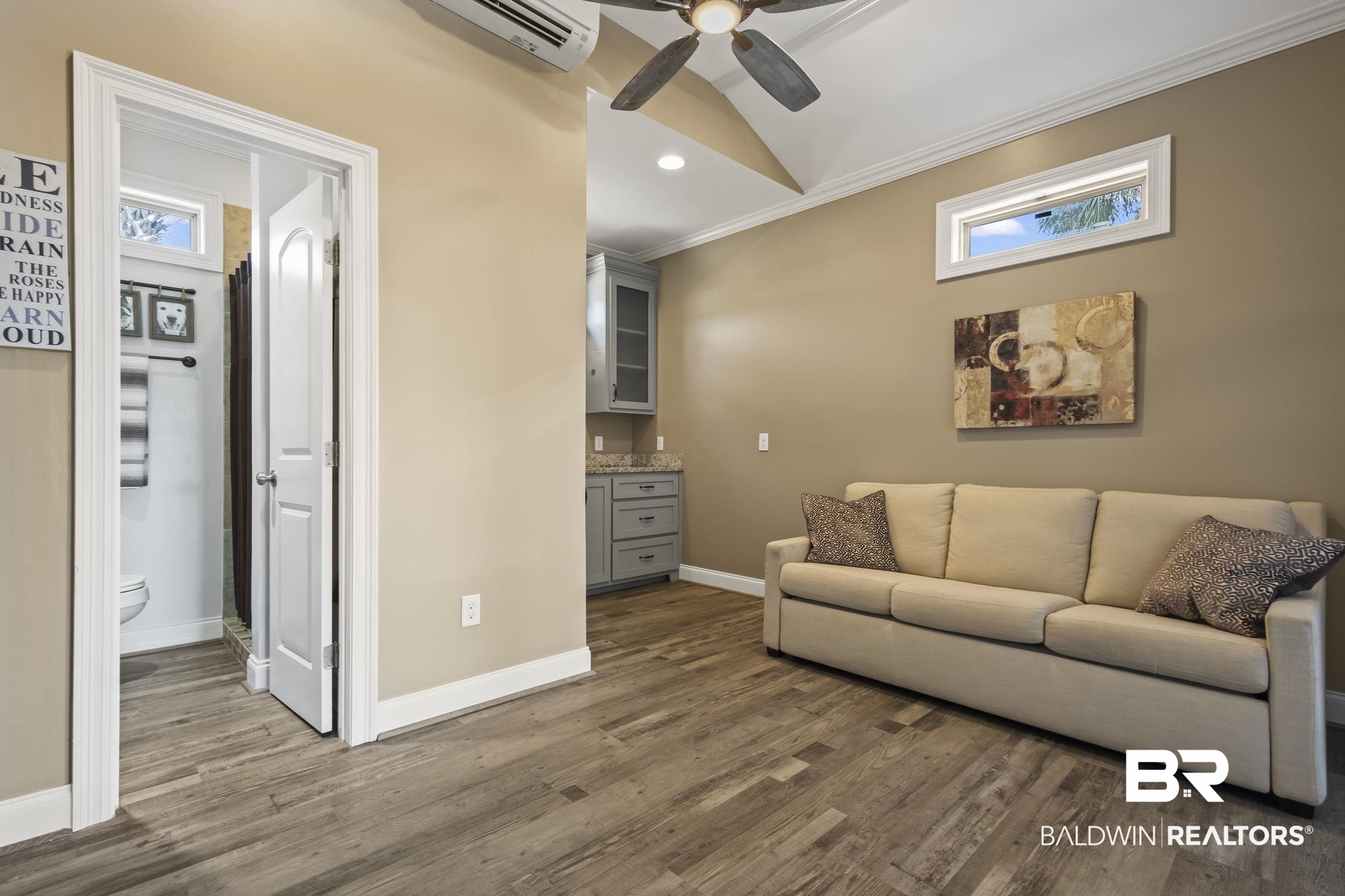 212 Magnifico Drive Foley, AL 36535 - Photo 21 of 50 Living room featuring a healthy amount of sunlight, ornamental molding, and dark hardwood / wood-style flooring