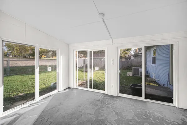 a view of a room with large windows