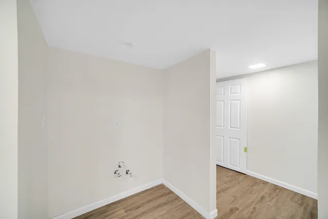 a view of room with wooden floor