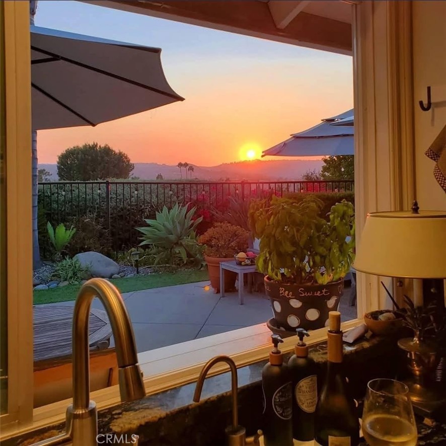 25222 Del Rio Laguna Niguel, CA 92677 - Photo 13 of 37 a view of a balcony with chairs and a fire pit
