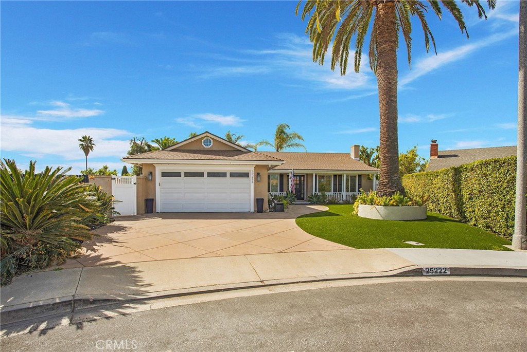 25222 Del Rio Laguna Niguel, CA 92677 - Photo 2 of 37 a front view of a house with a garden and yard