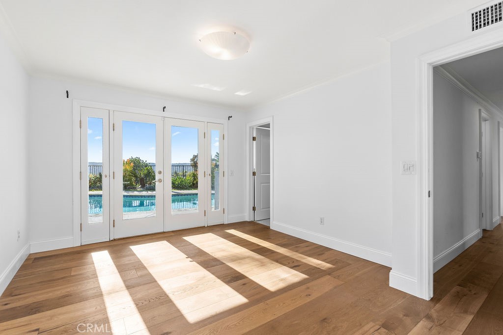 25222 Del Rio Laguna Niguel, CA 92677 - Photo 23 of 37 a view of an empty room with wooden floor and a window