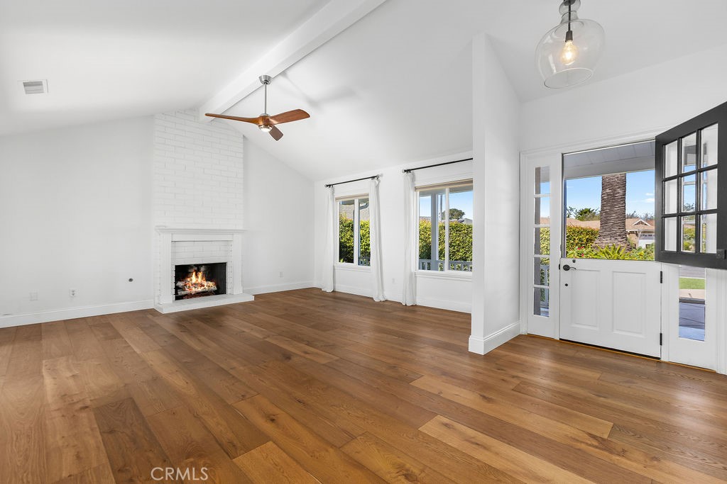 25222 Del Rio Laguna Niguel, CA 92677 - Photo 5 of 37 a view of an empty room with a window and fireplace
