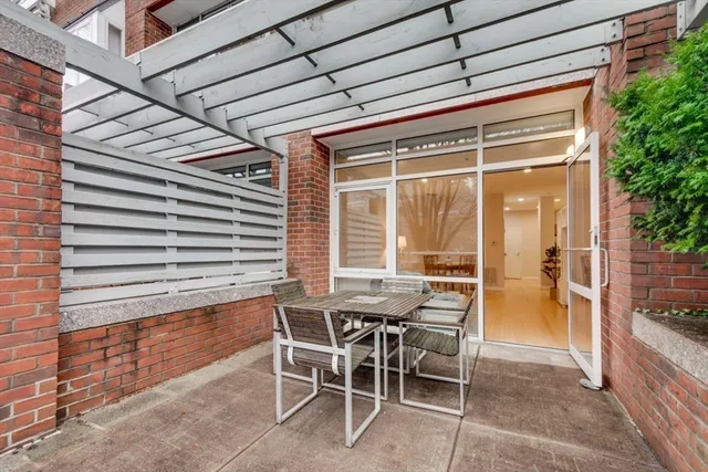 a view of an outdoor dining space with furniture