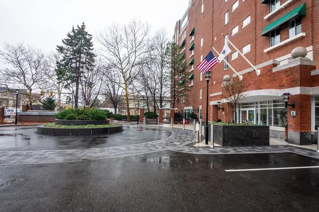 a view of a fountain with tree s