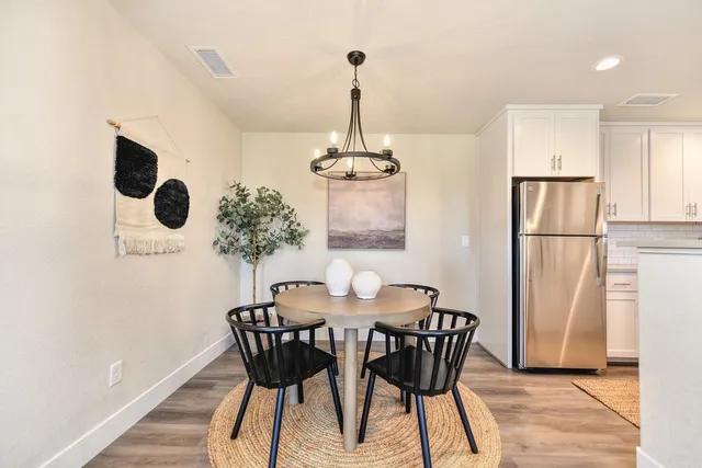 a dining room with furniture and window