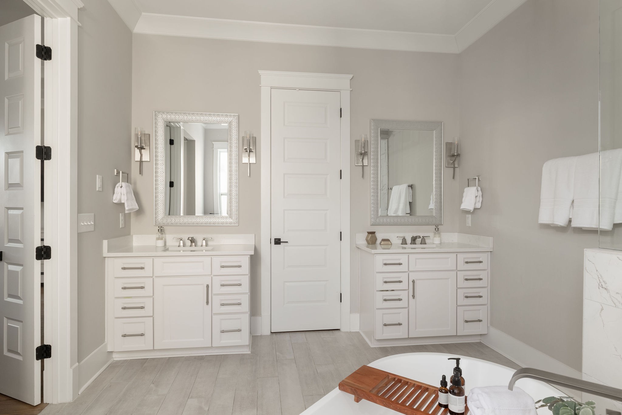 2186 Hartland Road Franklin, TN 37069 - Photo 39 of 74 wooden floor with white cabinets and sink