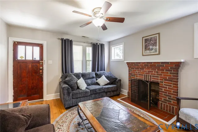 a living room with furniture and a fireplace