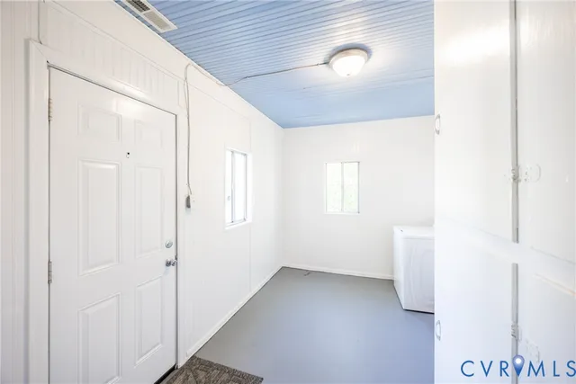 a view of empty room with windows