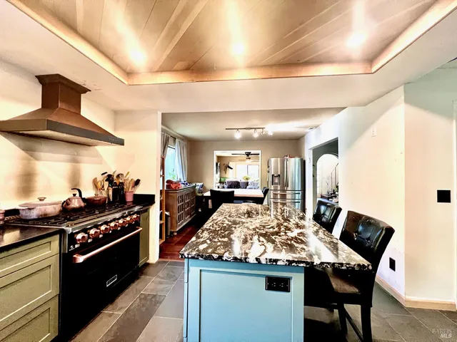a kitchen with a table and chairs