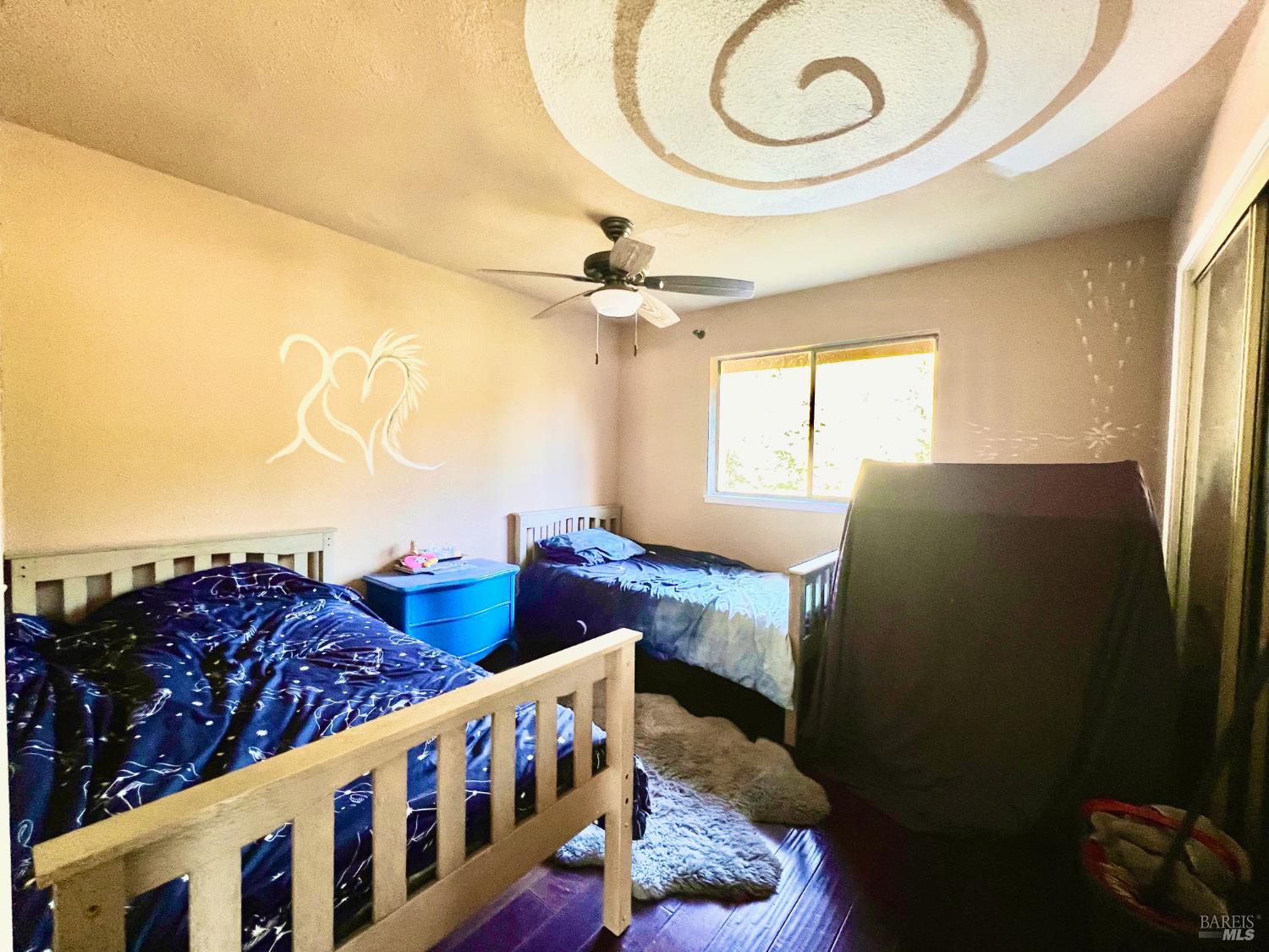 46720 Fox Rock Road Laytonville, CA 95454 - Photo 18 of 24 a bedroom with bed and a chandelier