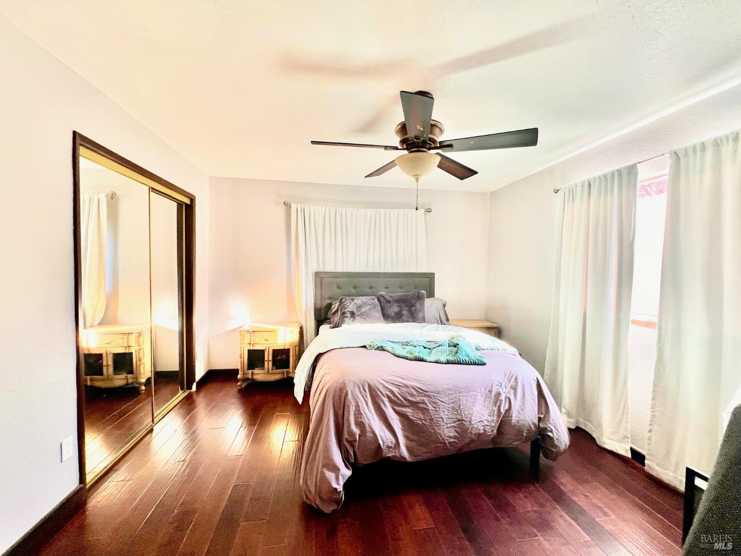 46720 Fox Rock Road Laytonville, CA 95454 - Photo 19 of 24 a bedroom with a bed and wooden floor