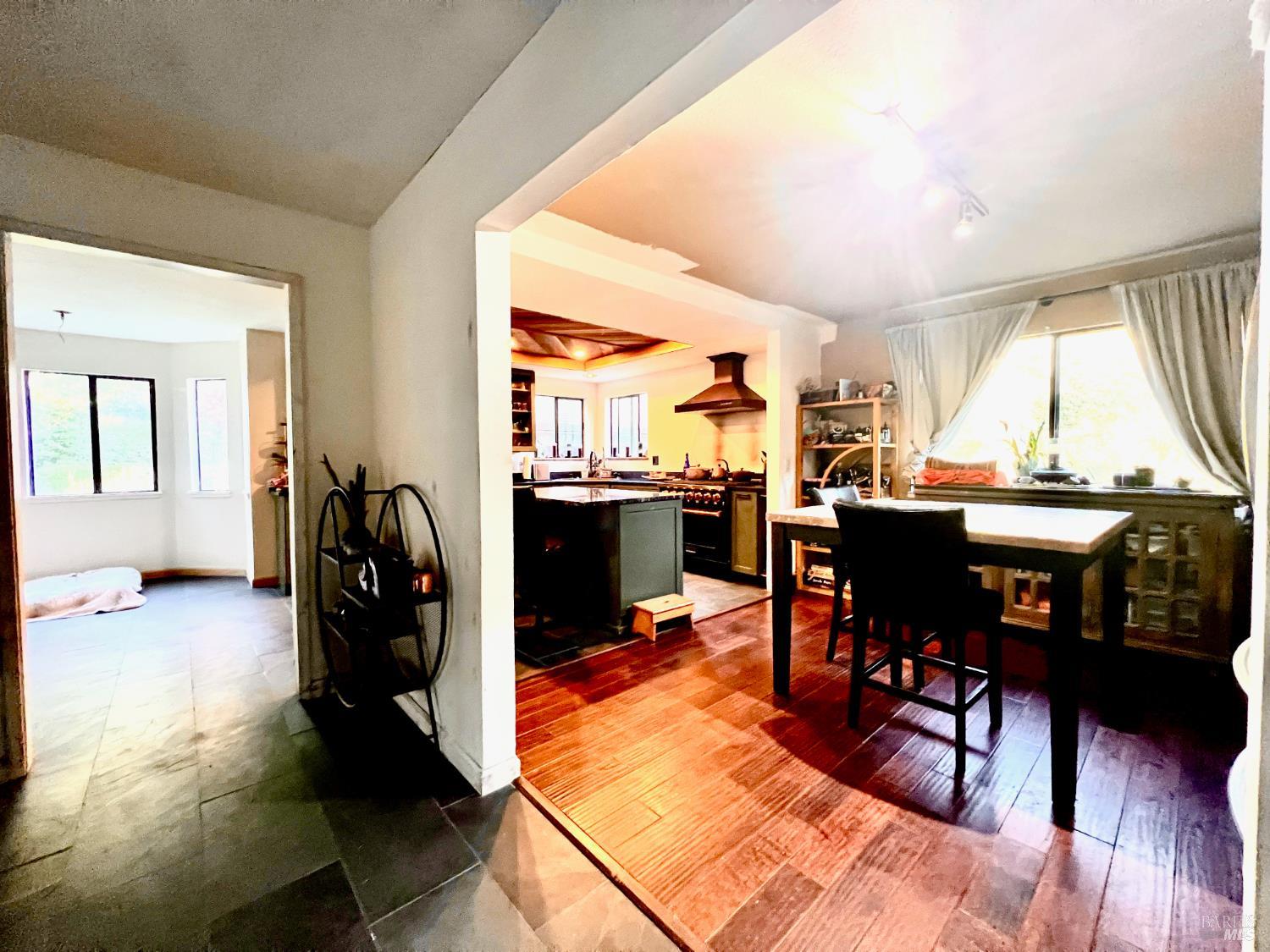 46720 Fox Rock Road Laytonville, CA 95454 - Photo 7 of 24 a view of a dining room with furniture window and wooden floor