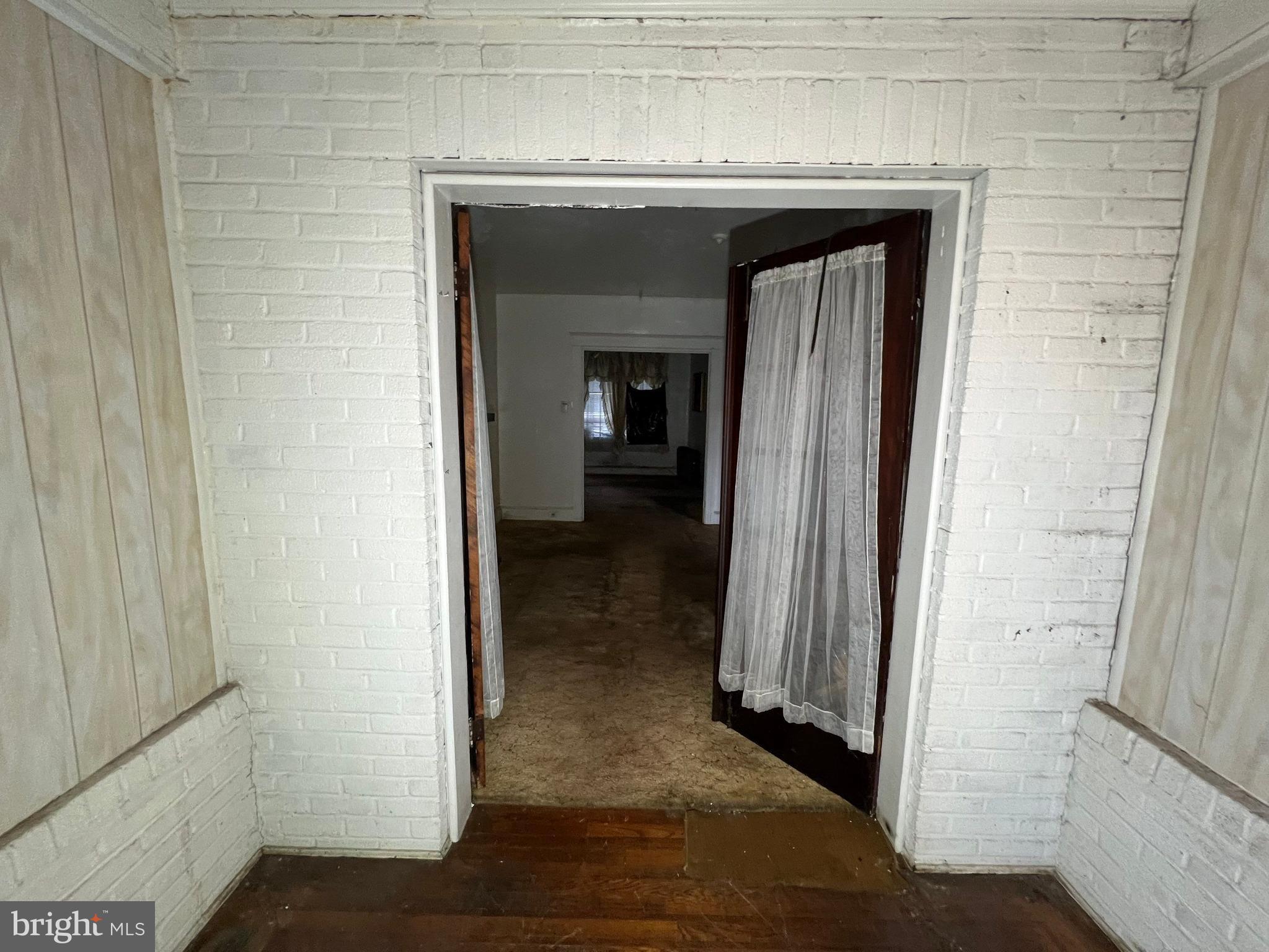 3421 St Ambrose Avenue Baltimore, MD 21215 - Photo 11 of 64 a view of a livingroom from a hallway