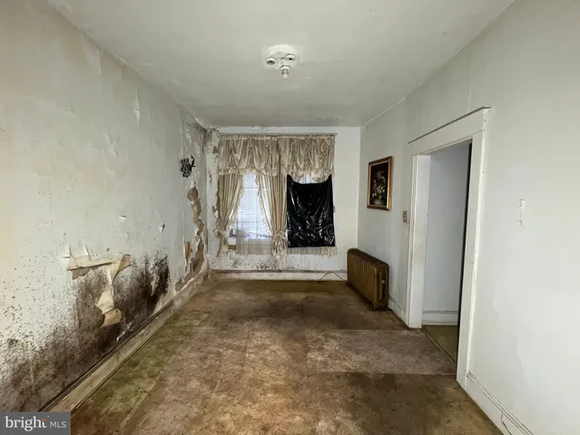 a kitchen with a sink and a stove top oven