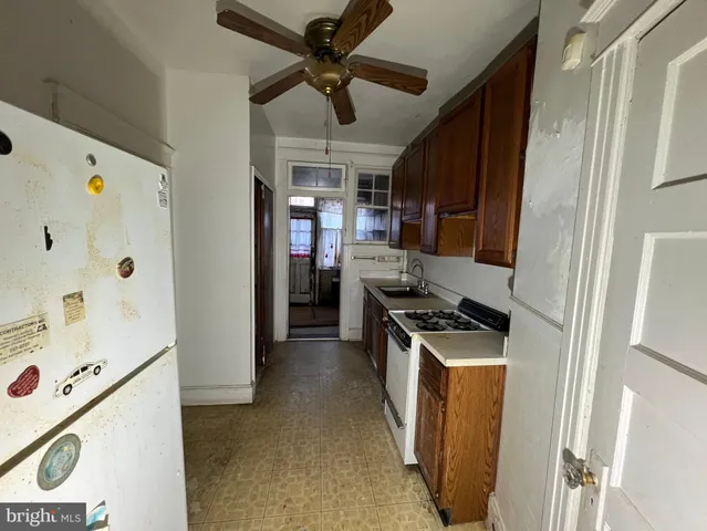 a kitchen with cabinets and appliances