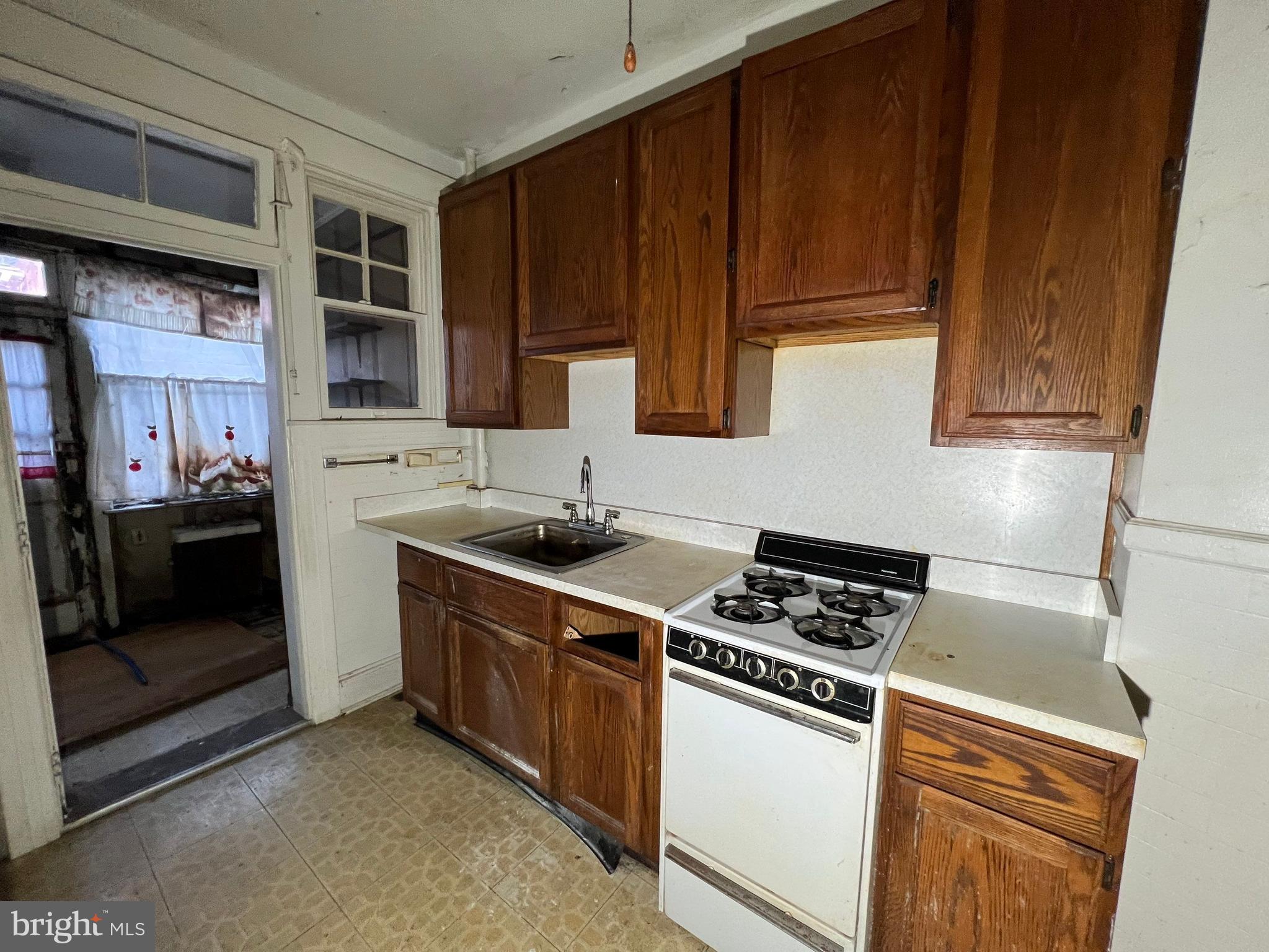 3421 St Ambrose Avenue Baltimore, MD 21215 - Photo 18 of 64 a kitchen with cabinets and appliances