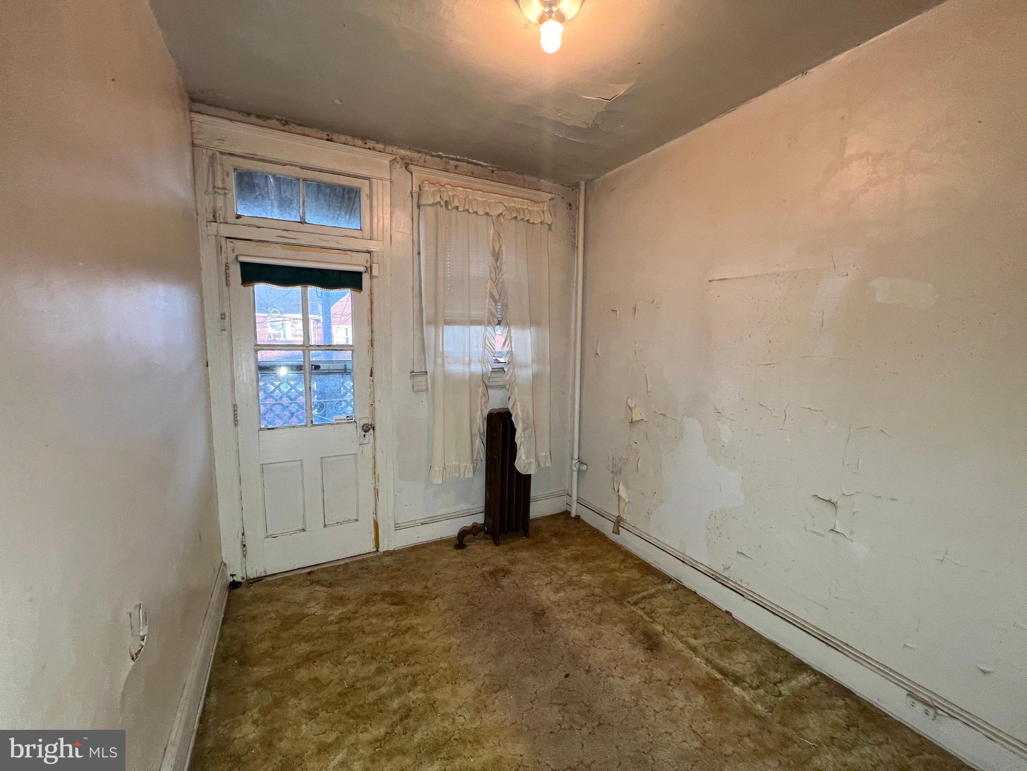 3421 St Ambrose Avenue Baltimore, MD 21215 - Photo 33 of 64 an empty room with window and stairs