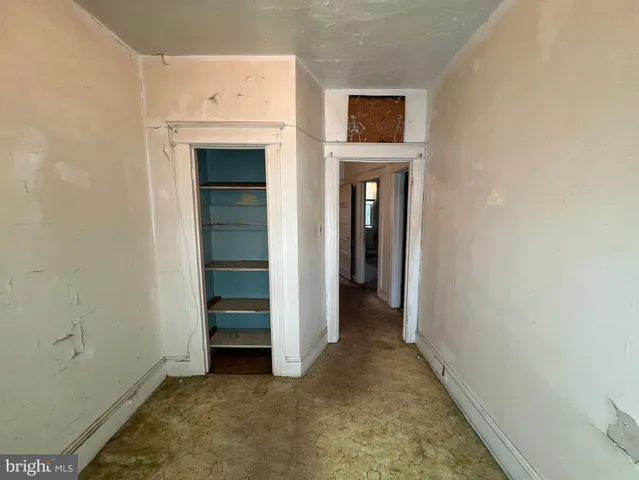 a view of a room with wooden walls