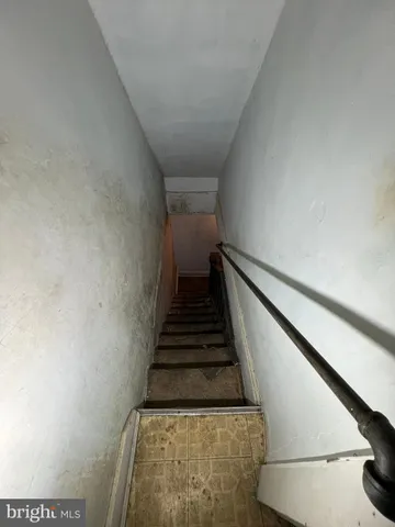 a front view of a house with entryway and wooden floor