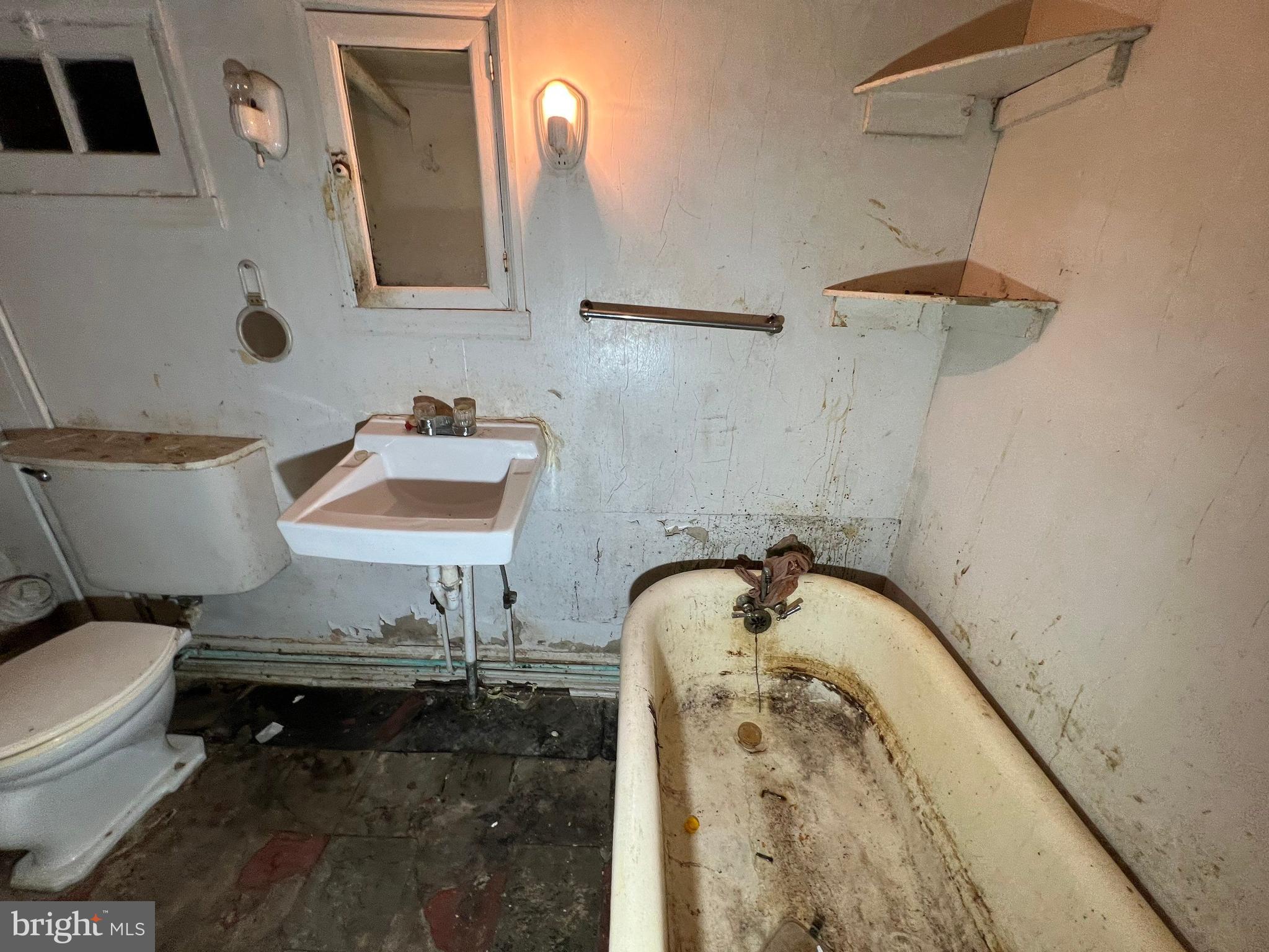 3421 St Ambrose Avenue Baltimore, MD 21215 - Photo 45 of 64 a bathroom with a sink and a toilet