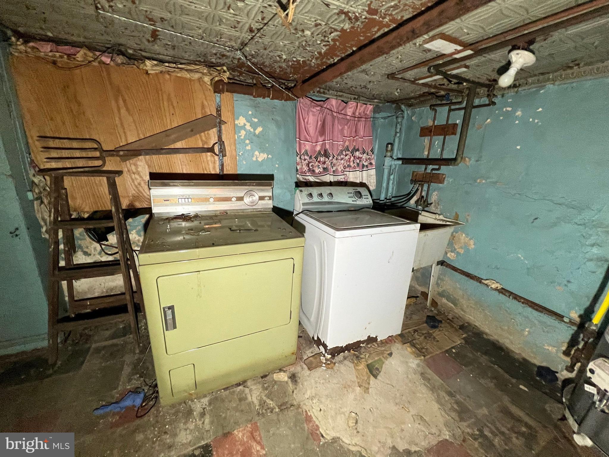 3421 St Ambrose Avenue Baltimore, MD 21215 - Photo 50 of 64 a utility room with dryer and washer