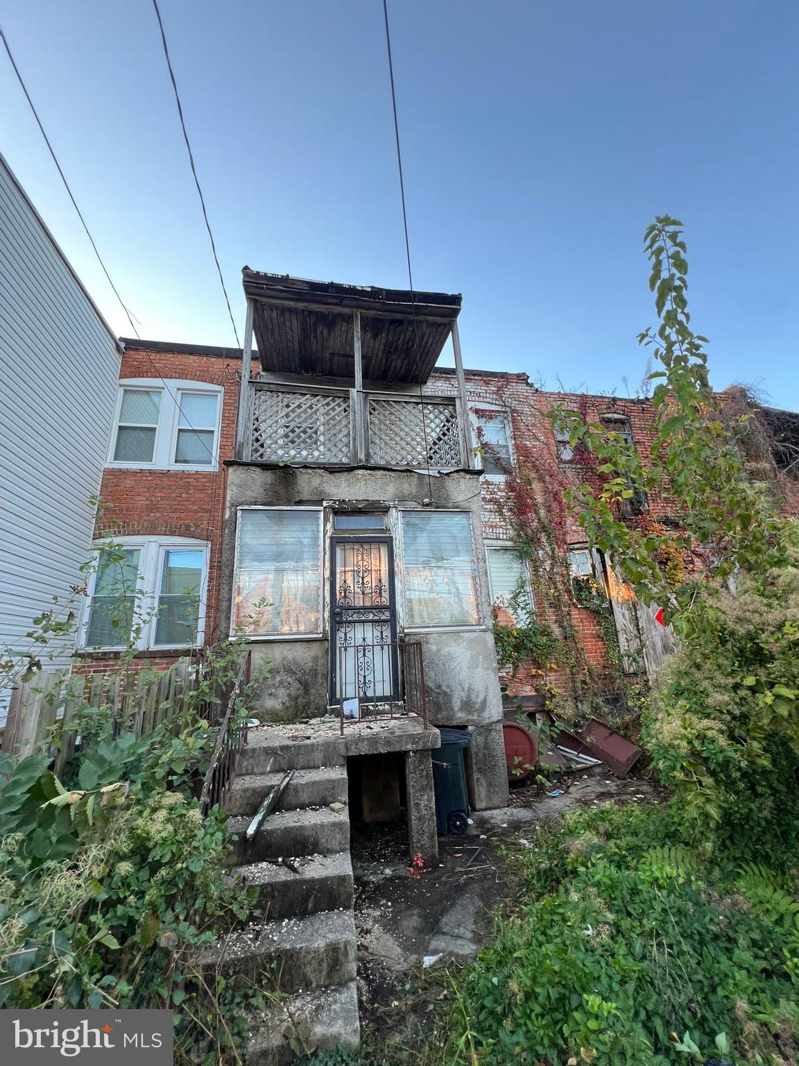 3421 St Ambrose Avenue Baltimore, MD 21215 - Photo 56 of 64 a front view of a house with a yard