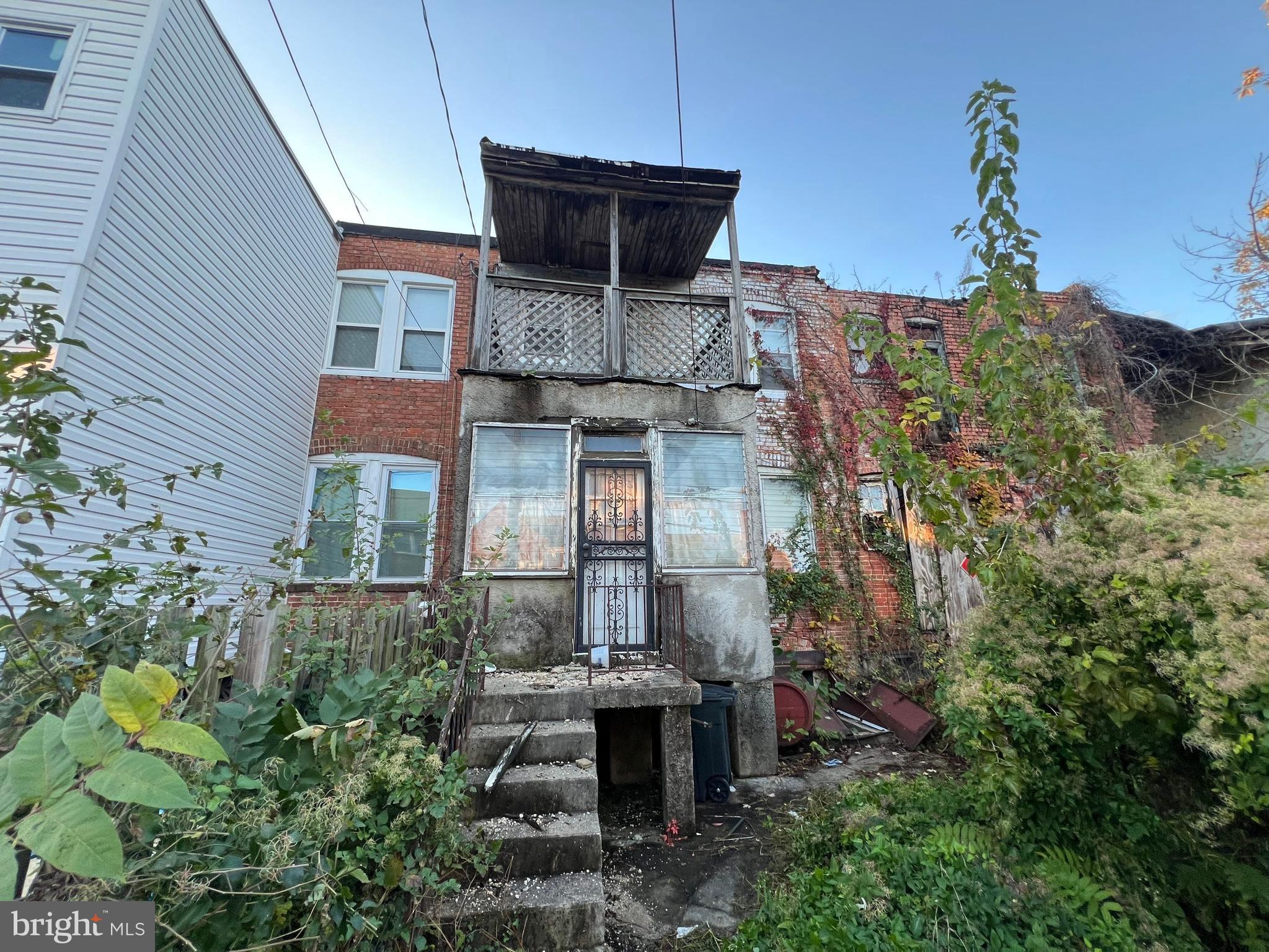 3421 St Ambrose Avenue Baltimore, MD 21215 - Photo 57 of 64 a front view of a house with a garden