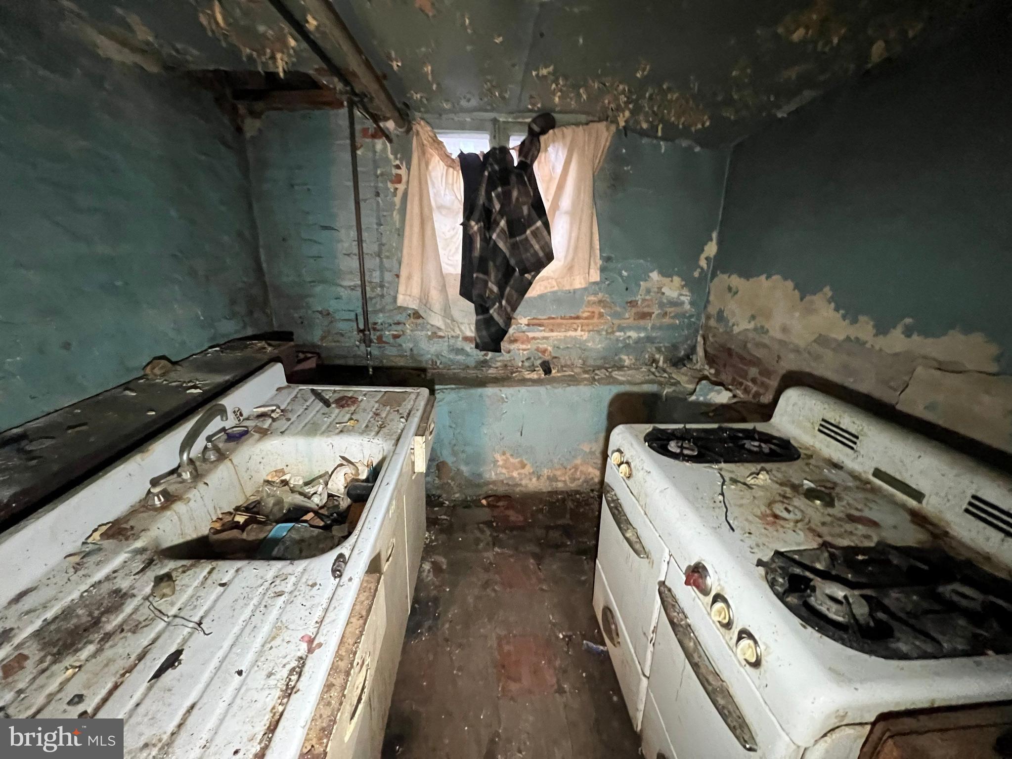 3421 St Ambrose Avenue Baltimore, MD 21215 - Photo 59 of 64 a kitchen with a stove and a sink