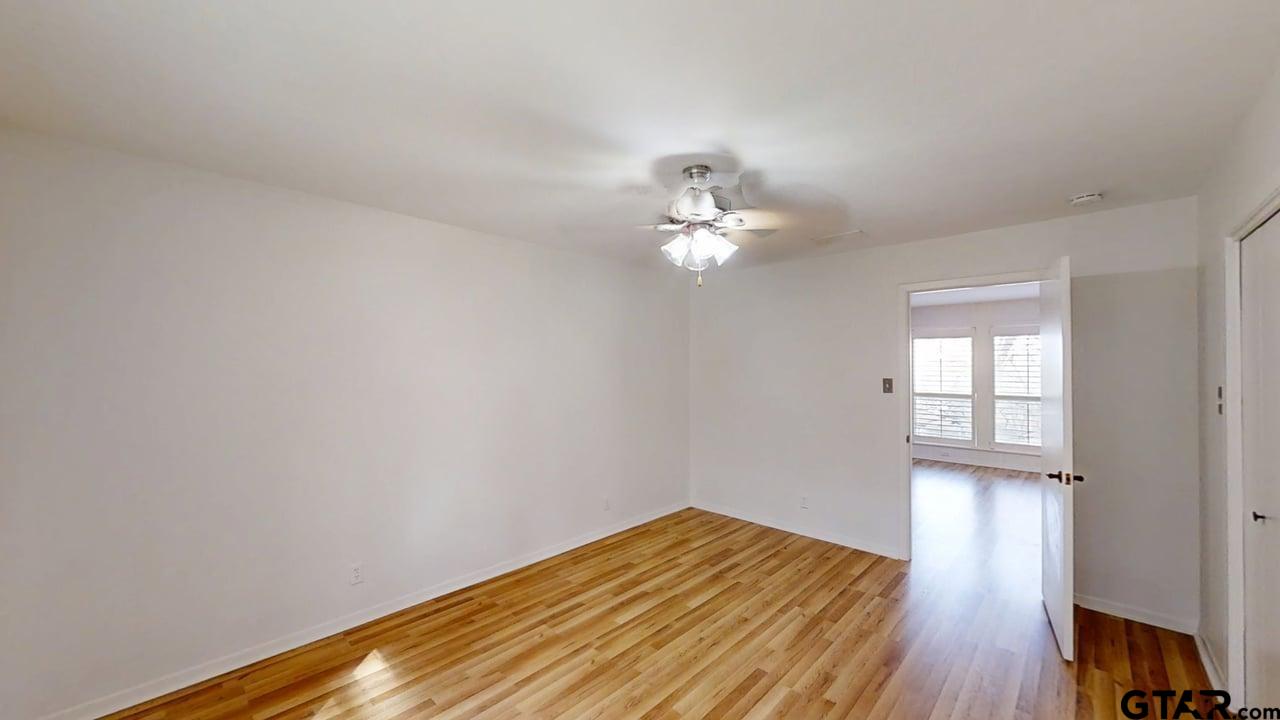 17035 Deer Run Road Flint, TX 75762 - Photo 11 of 31 a view of empty room with wooden floor