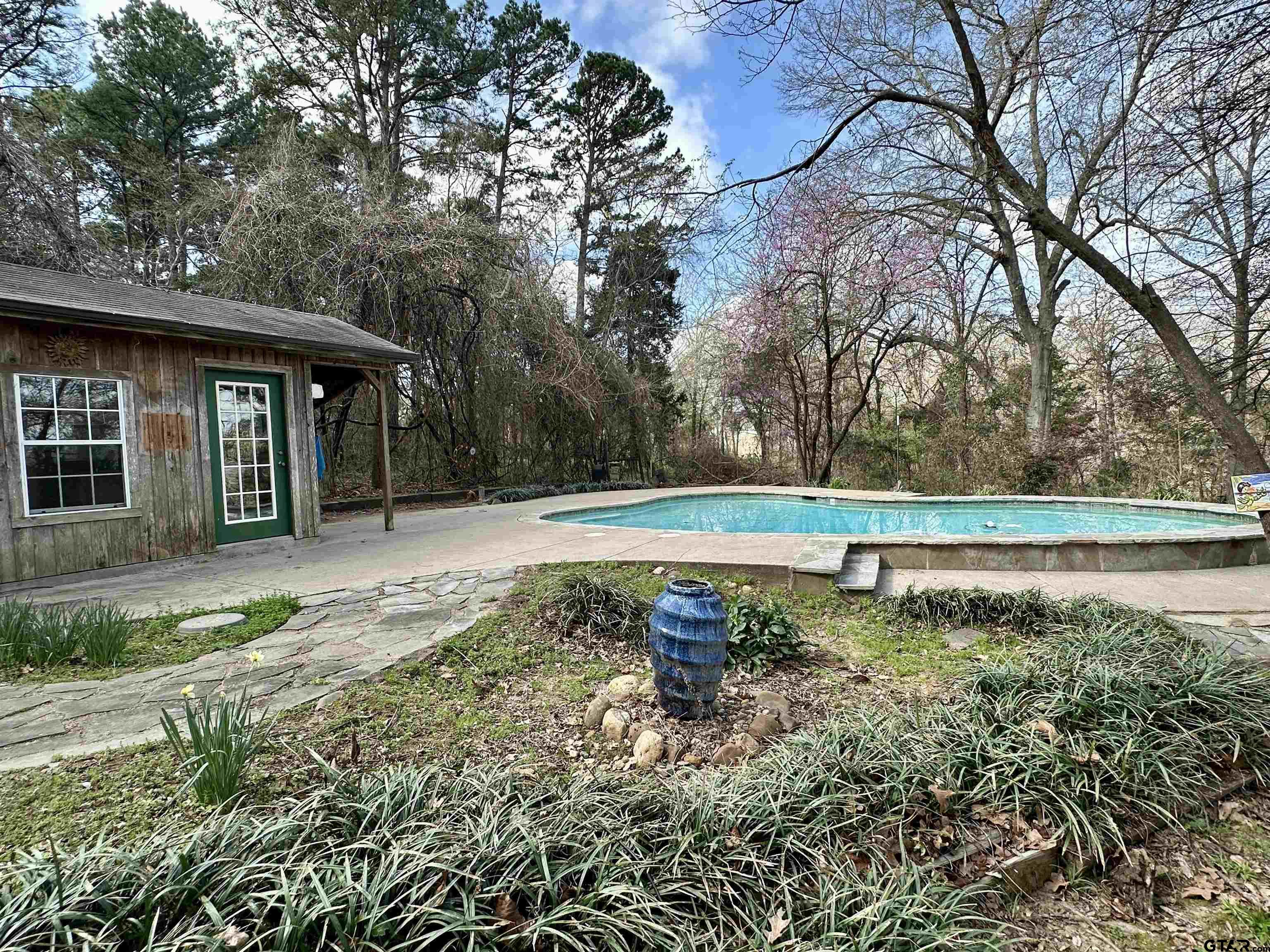 17035 Deer Run Road Flint, TX 75762 - Photo 17 of 31 a view of backyard with large trees and wooden fence