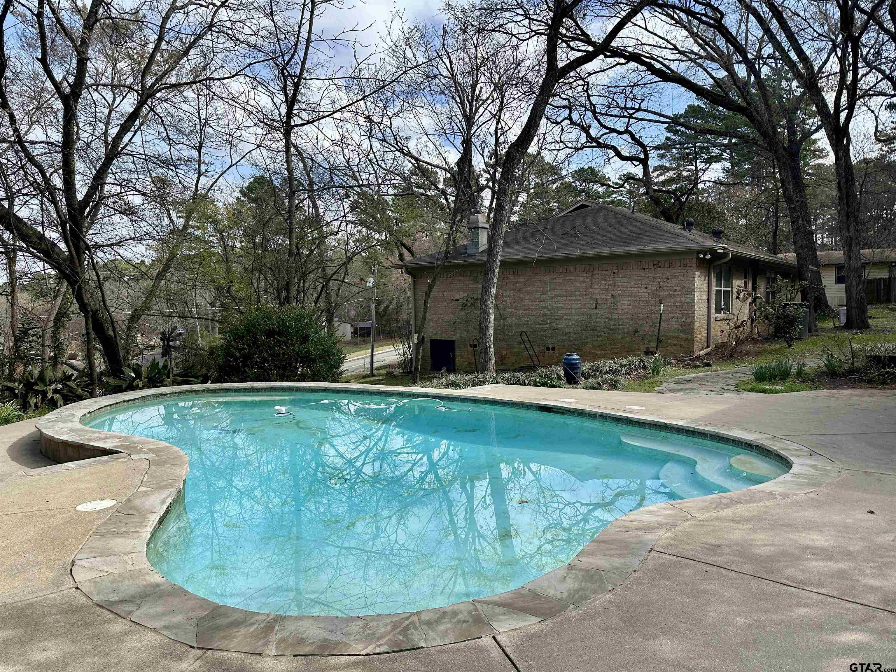 17035 Deer Run Road Flint, TX 75762 - Photo 19 of 31 a view of a swimming pool with a patio